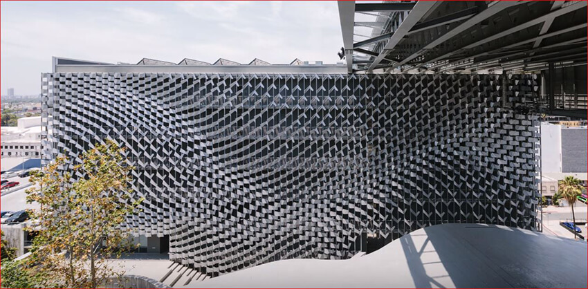 a parametric façade of a commercial building that is made with expanded metal