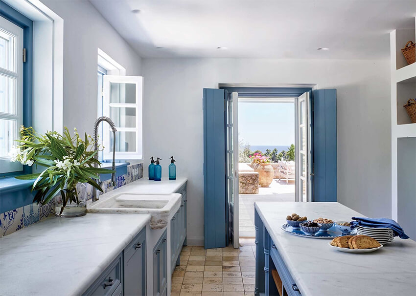 A kitchen with blue shades