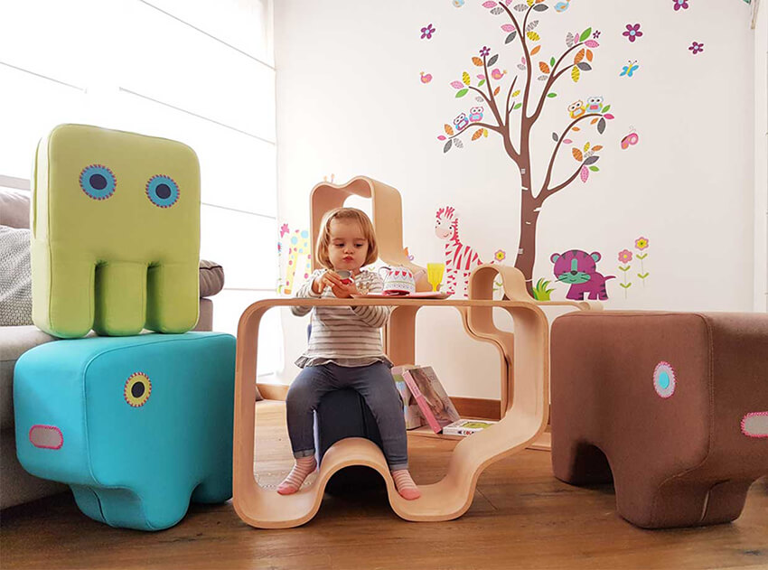 furniture in different shapes and colors in a kindergarten classroom