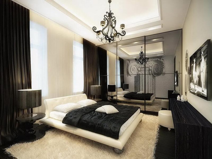 a bedroom with black and white decoration