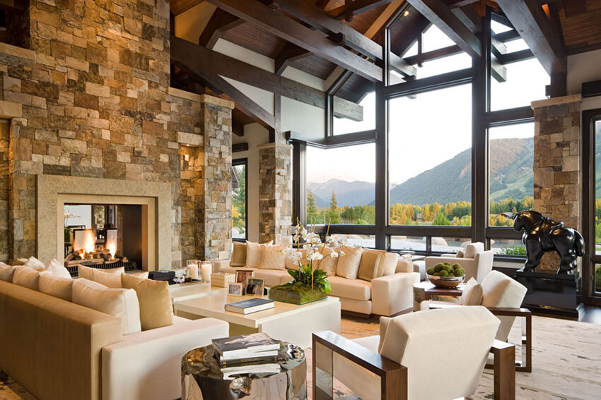 a living room with wood and stone materials