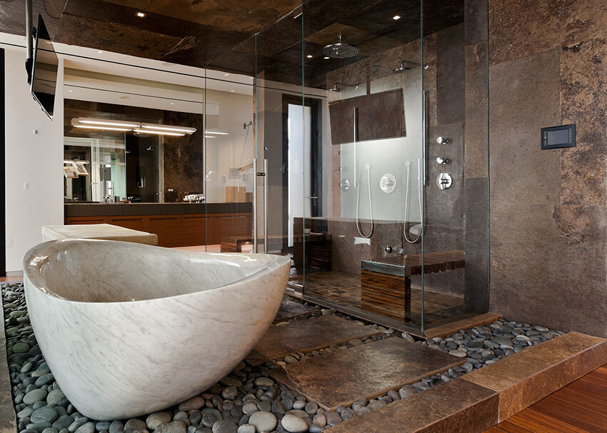 A bathroom interior with stone flooring