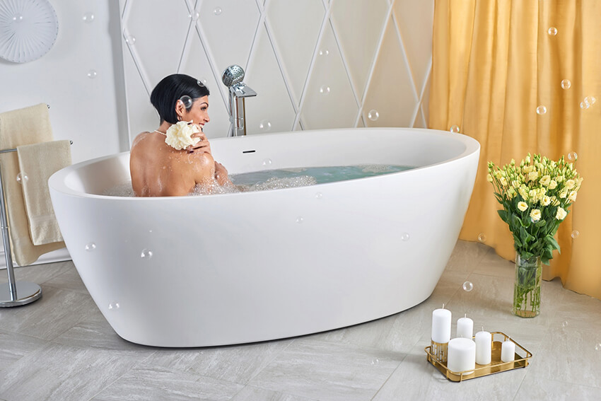 A bathroom with an herbal stone composite bathtub