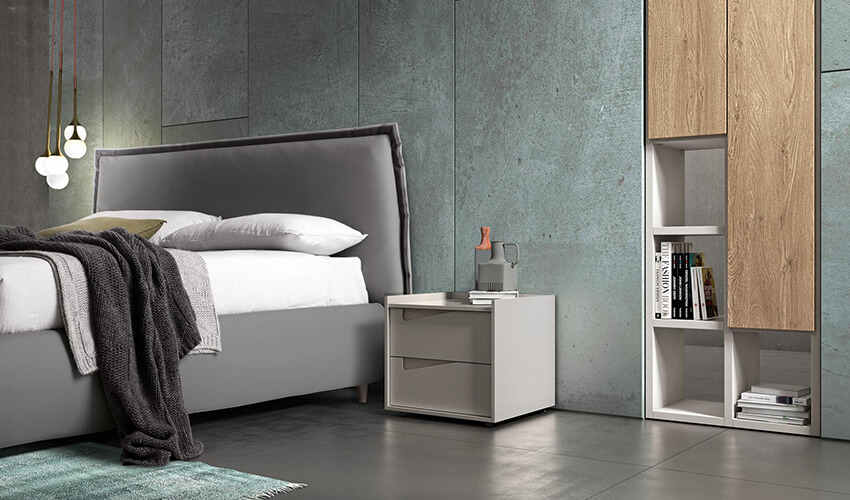 a bedroom with concrete walls