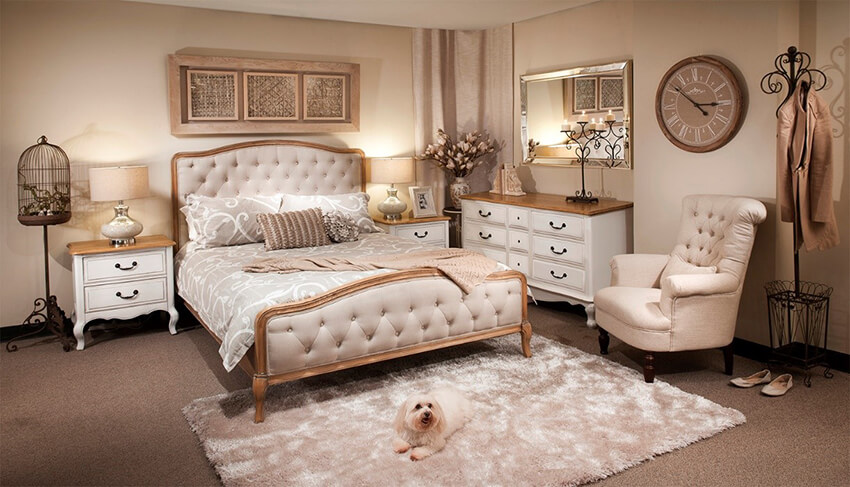 a bedroom with white and golden decoration