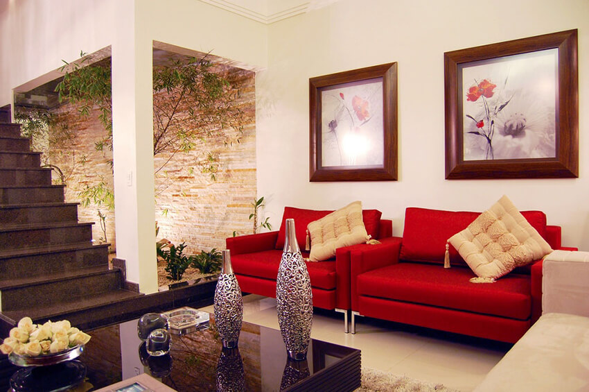 A living room with red sofas