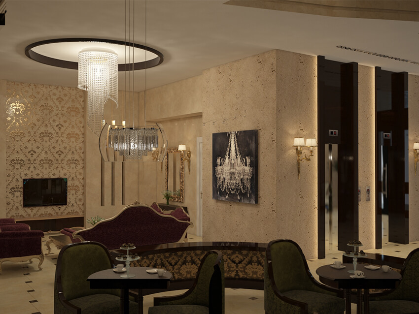 A hotel lobby with sitting area with chandeliers near the elevator