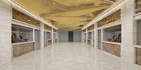 shopping aisle of a commercial building with a triangulated golden ceiling