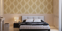 gold wallpaper above the bed in the bedroom interior space