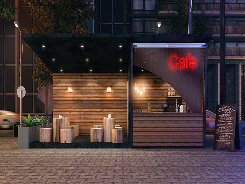 the main façade of a small wooden café with a sitting area