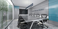 conference room of a modern office with stone flooring and a linear pendant light 