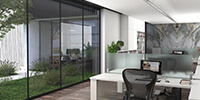 the working area of a modern office with large windows and view to the surrounding landscape
