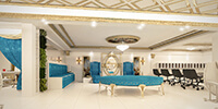 The waiting area of a luxury bright color bridal salon with classic blue color furniture and crystal chandelier
