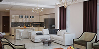 A light living room fully furnished with white brown sofas