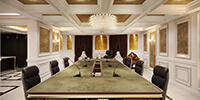 a luxury conference room with crystal chandelier and gold wall patina