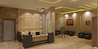 a modern reception area with stone flooring and hidden ceiling lights