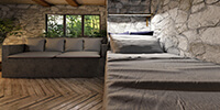 rustic bedroom interior space with a built-in stone bed and natural wood flooring