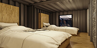 interior space of a bedroom in the container with parquet flooring and white beds